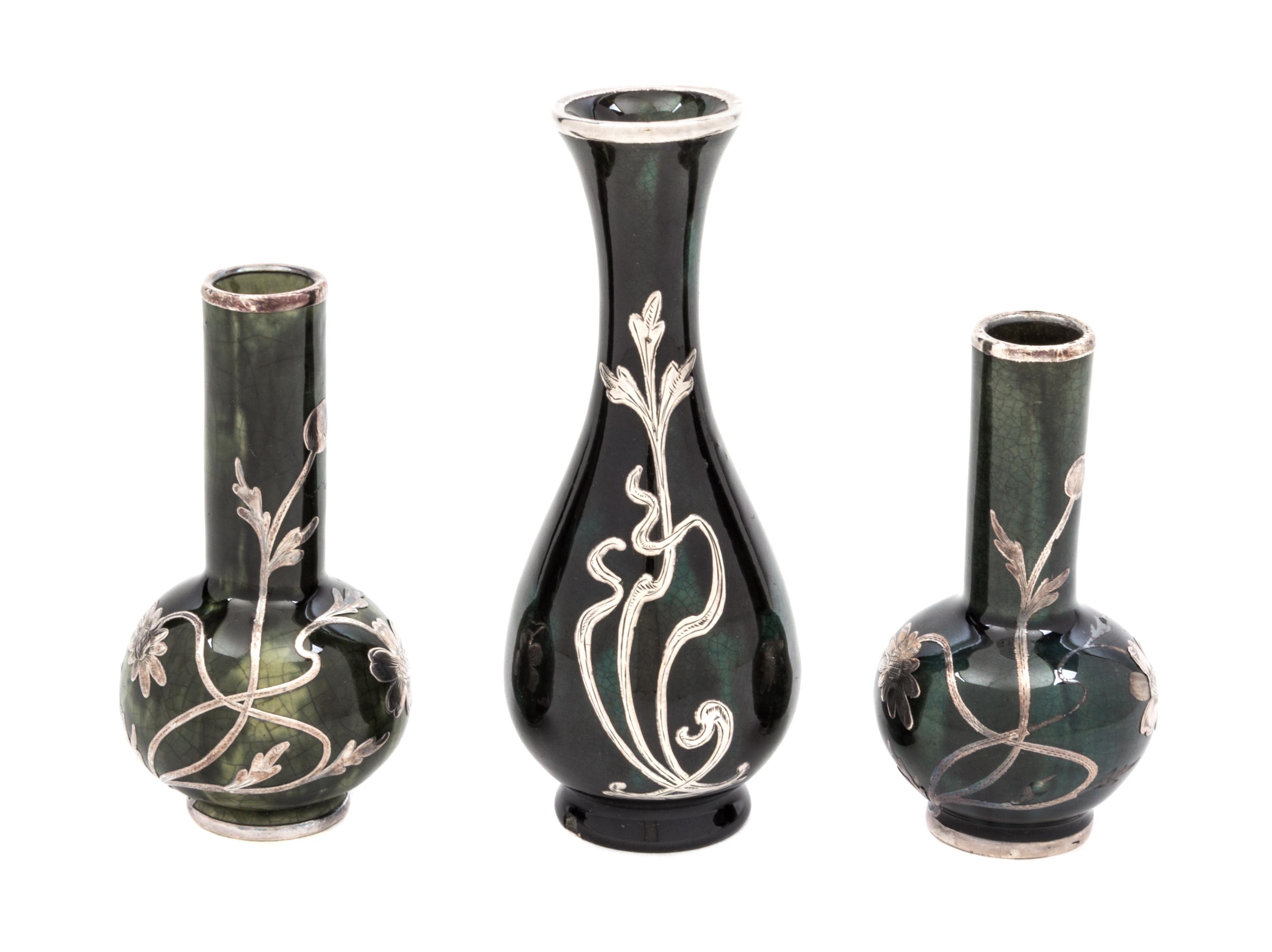 Three Ceramic Silver Overlay Cabinet Vases Height of tallest 5 inches.