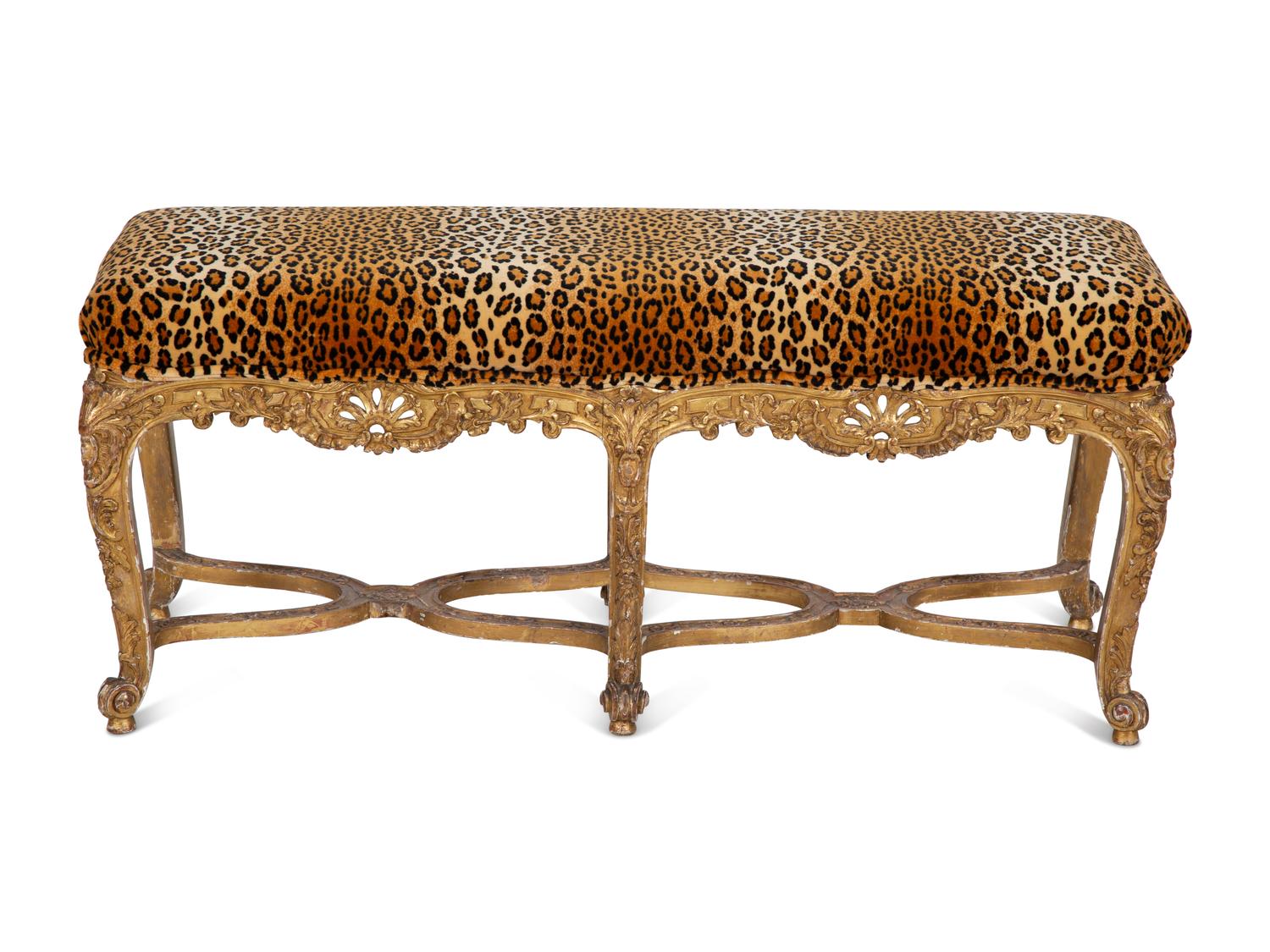 A Louis XV Style Giltwood Bench with Faux Leopard Upholstery