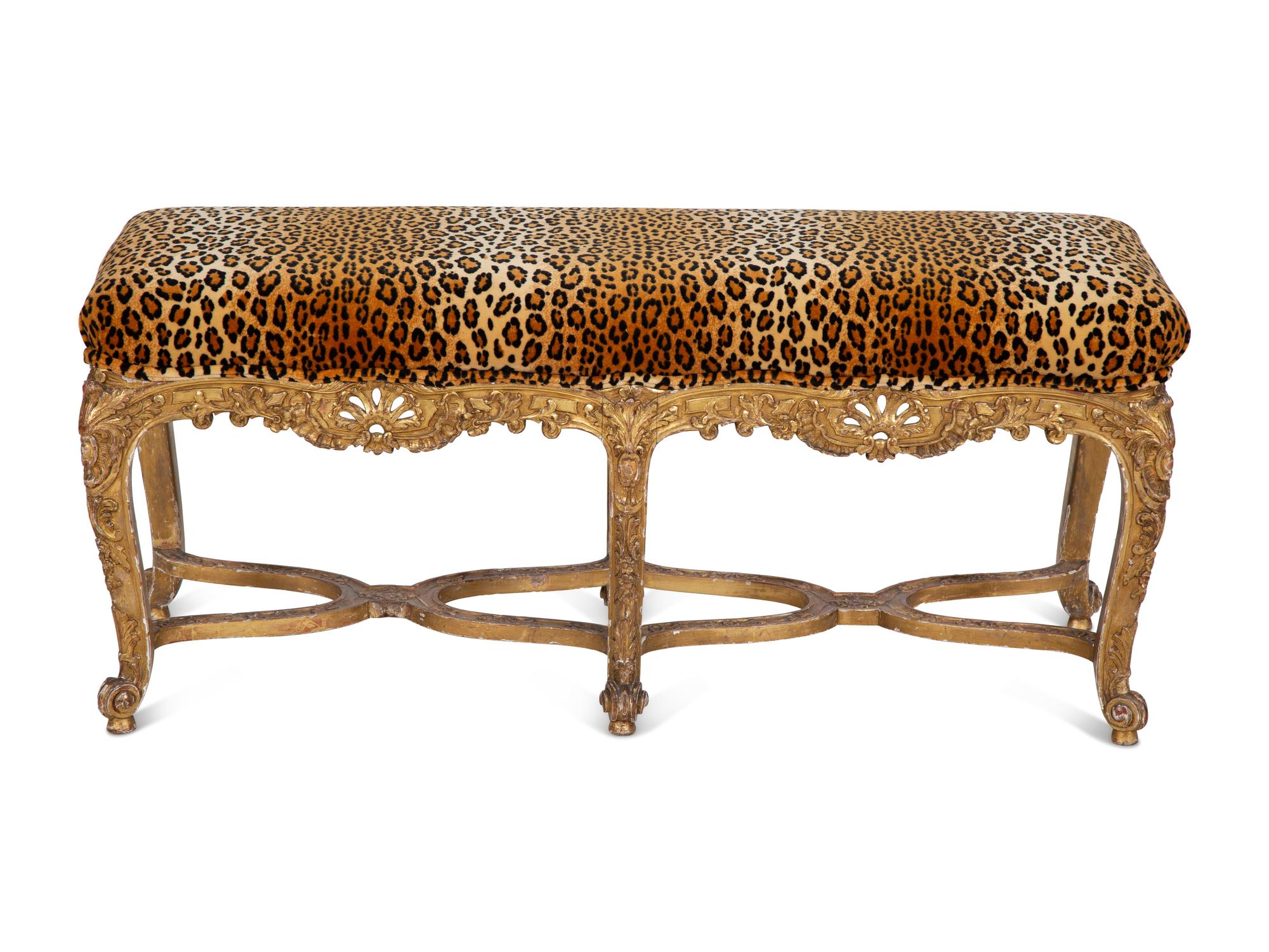 A Louis XV Style Giltwood Bench with Faux Leopard Upholstery
