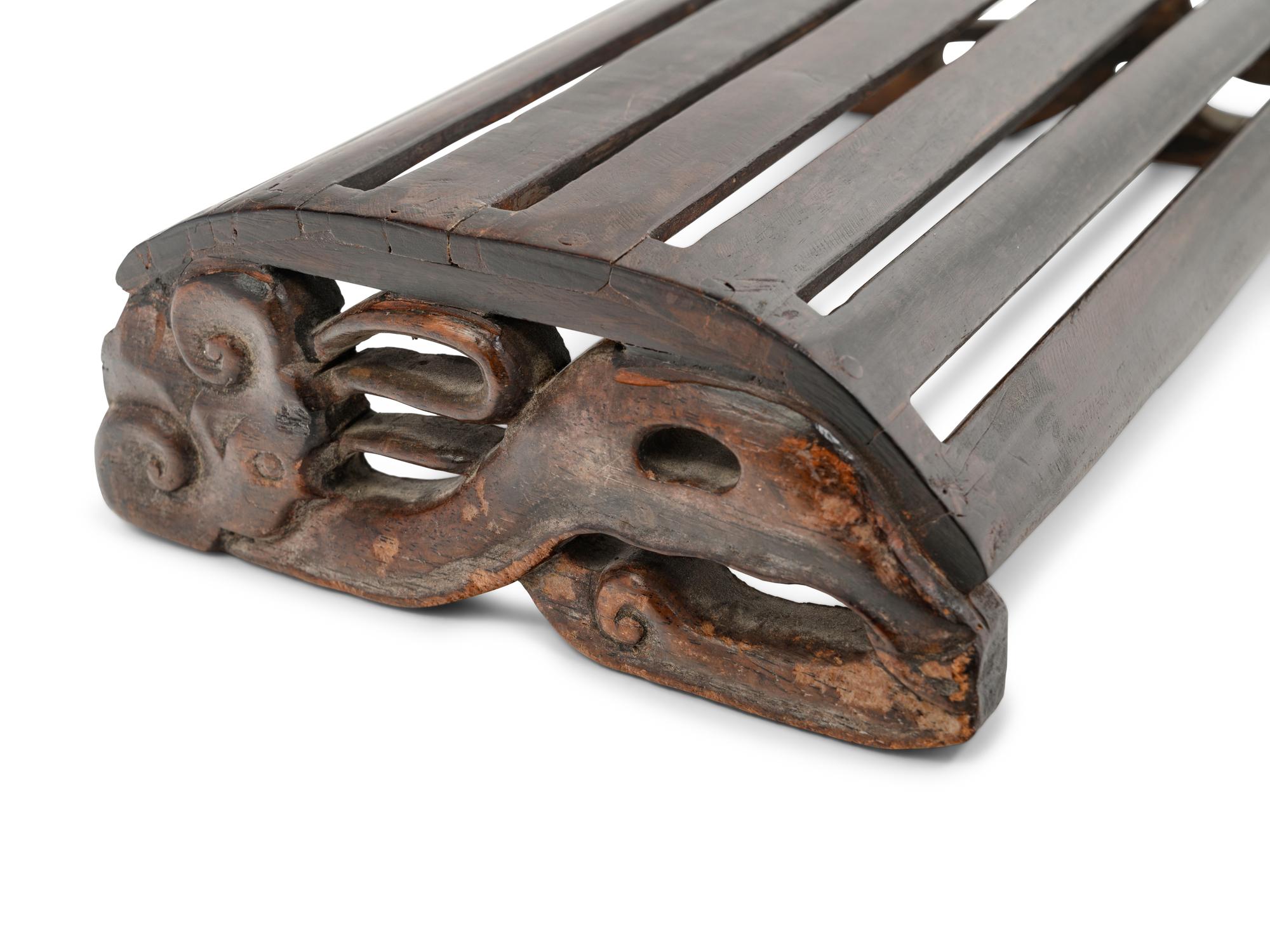 A Chinese Hardwood 'Demi-Lune' Foot Rest