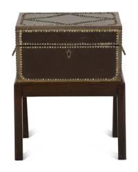 An English Brass Bound Leather Box with Brass Nailhead Trim on a Fitted Mahogany Stand