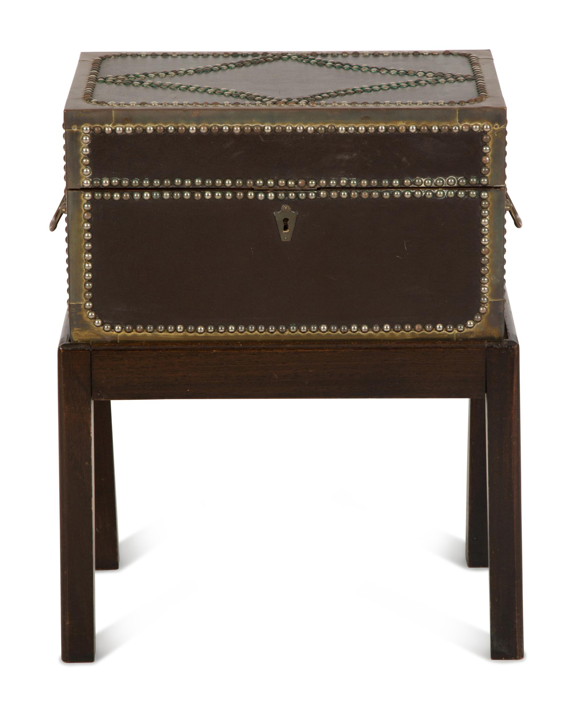 An English Brass Bound Leather Box with Brass Nailhead Trim on a Fitted Mahogany Stand