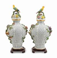 A Pair of Continental Porcelain Covered Urns