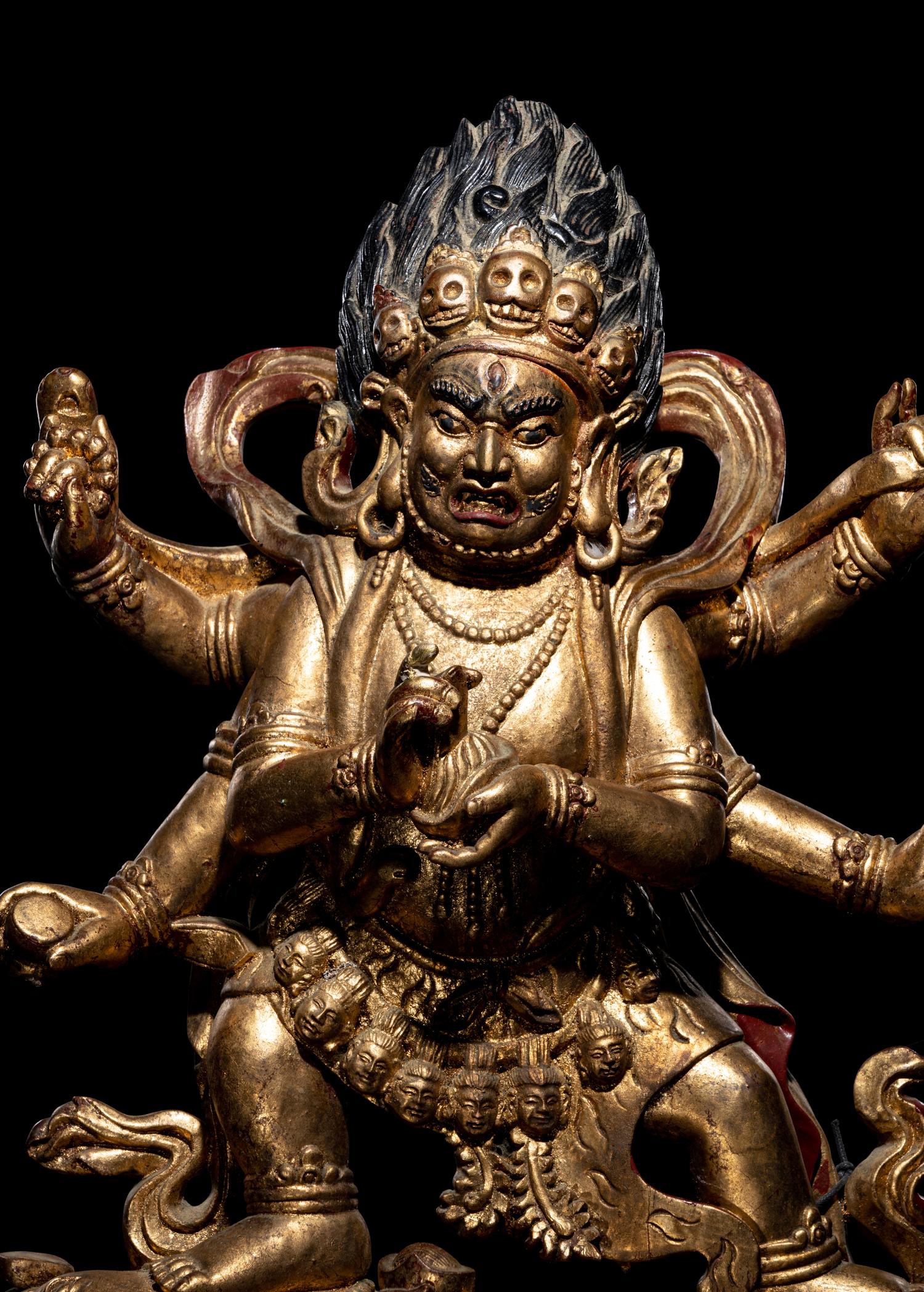 A Large Sino-Tibetan Gilt and Red Lacquered Wood Figure of a Mahākāla