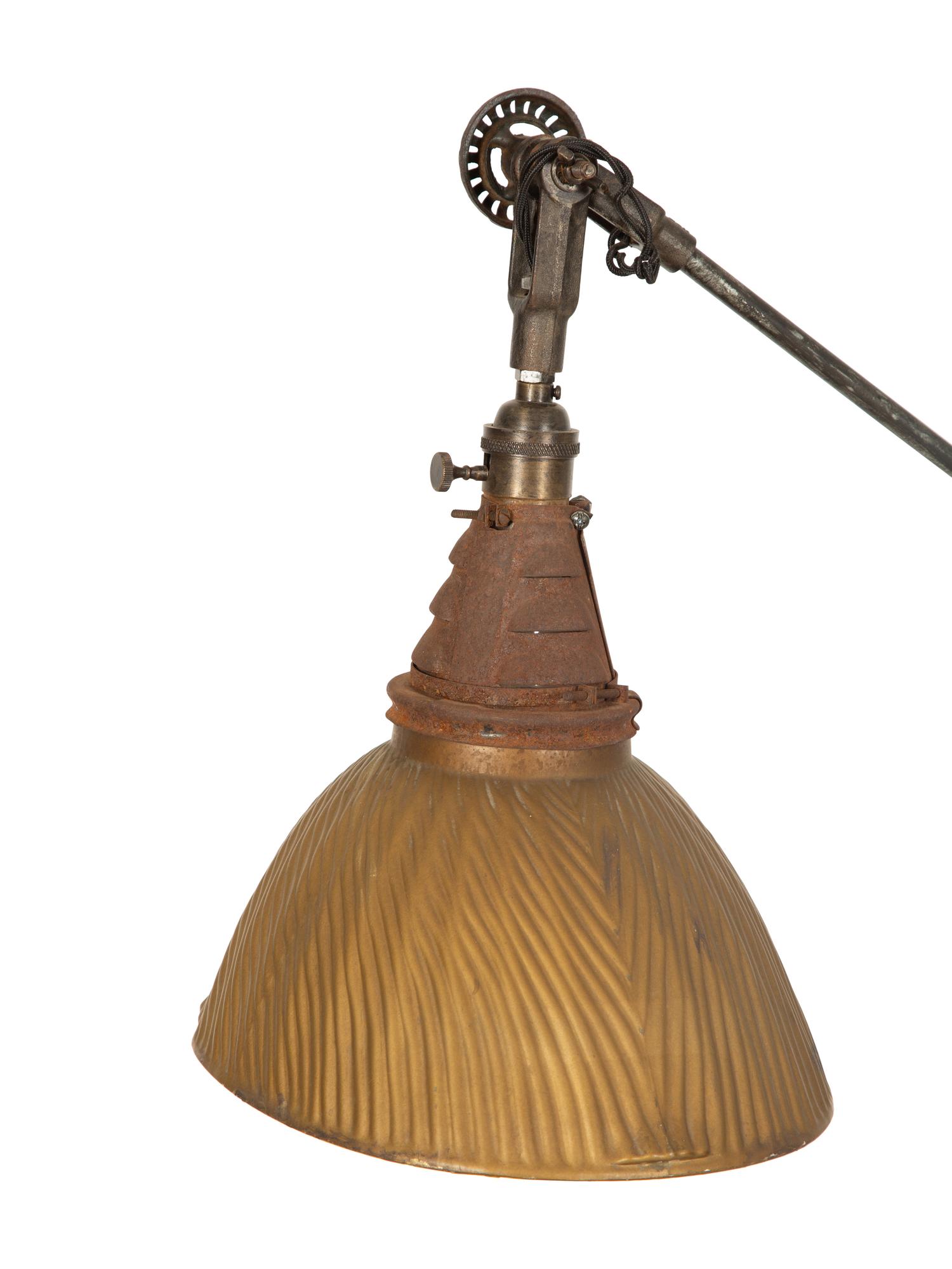 A Steel Tripod Base Articulated Floor Lamp