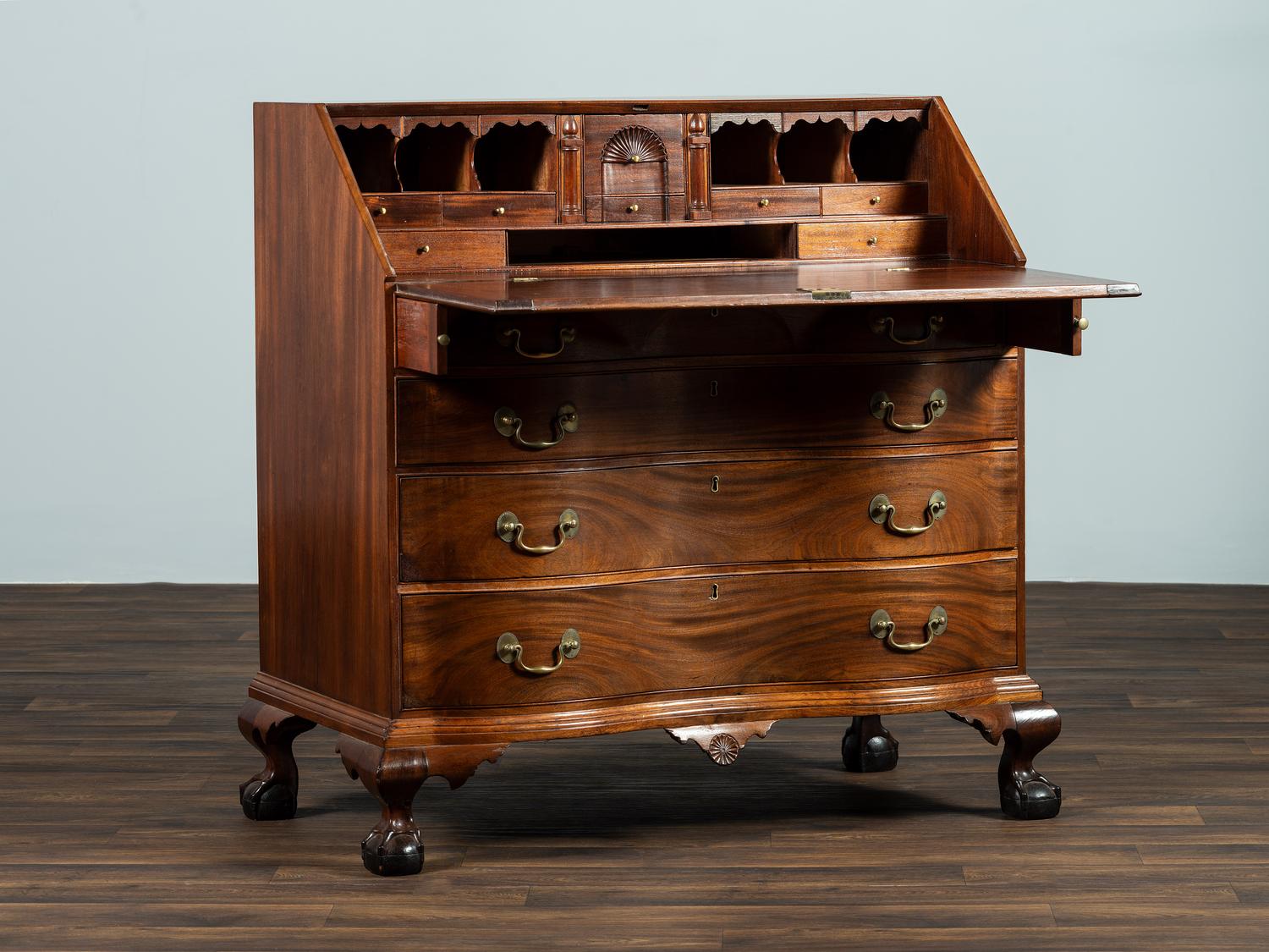 A Chippendale Carved Mahogany Reverse Serpentine Block-Front Desk