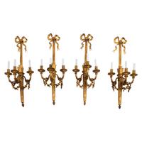 A Set of Four Large French Gilt Bronze Three-Light Sconces