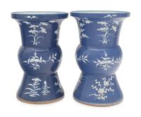 A Pair of Chinese Blue Ground White Slip Decorated Porcelain Spittoons