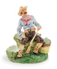 A Ceramic Figurine of a Cowboy