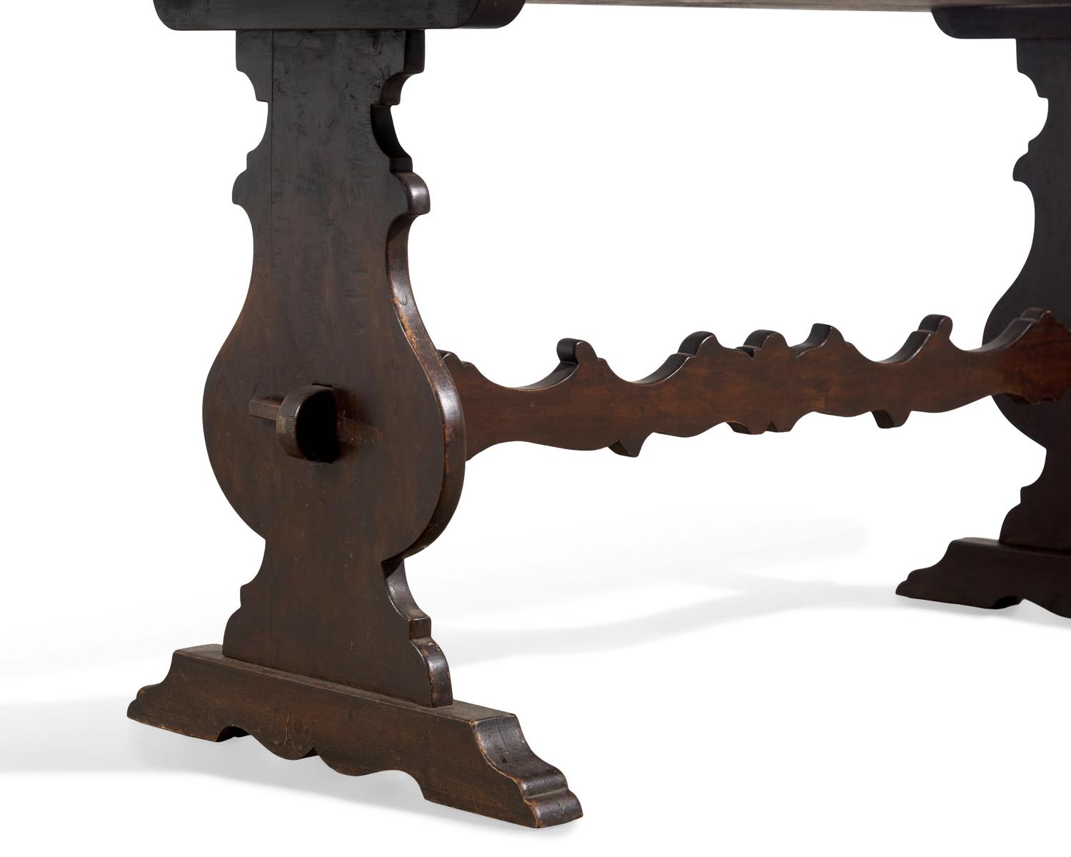 A Baroque Style Stained Fruitwood Trestle Table