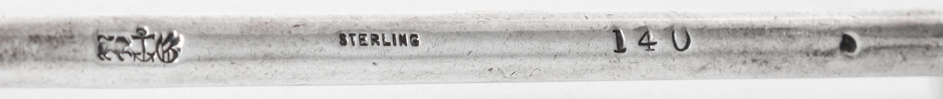 A Pair of American Silver Knife Rests, Gorham Mfg. Co., Providence, RI, each raised on two shaped supports