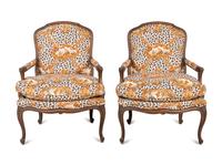 A Pair of Louis XV Style Oak Fauteuils