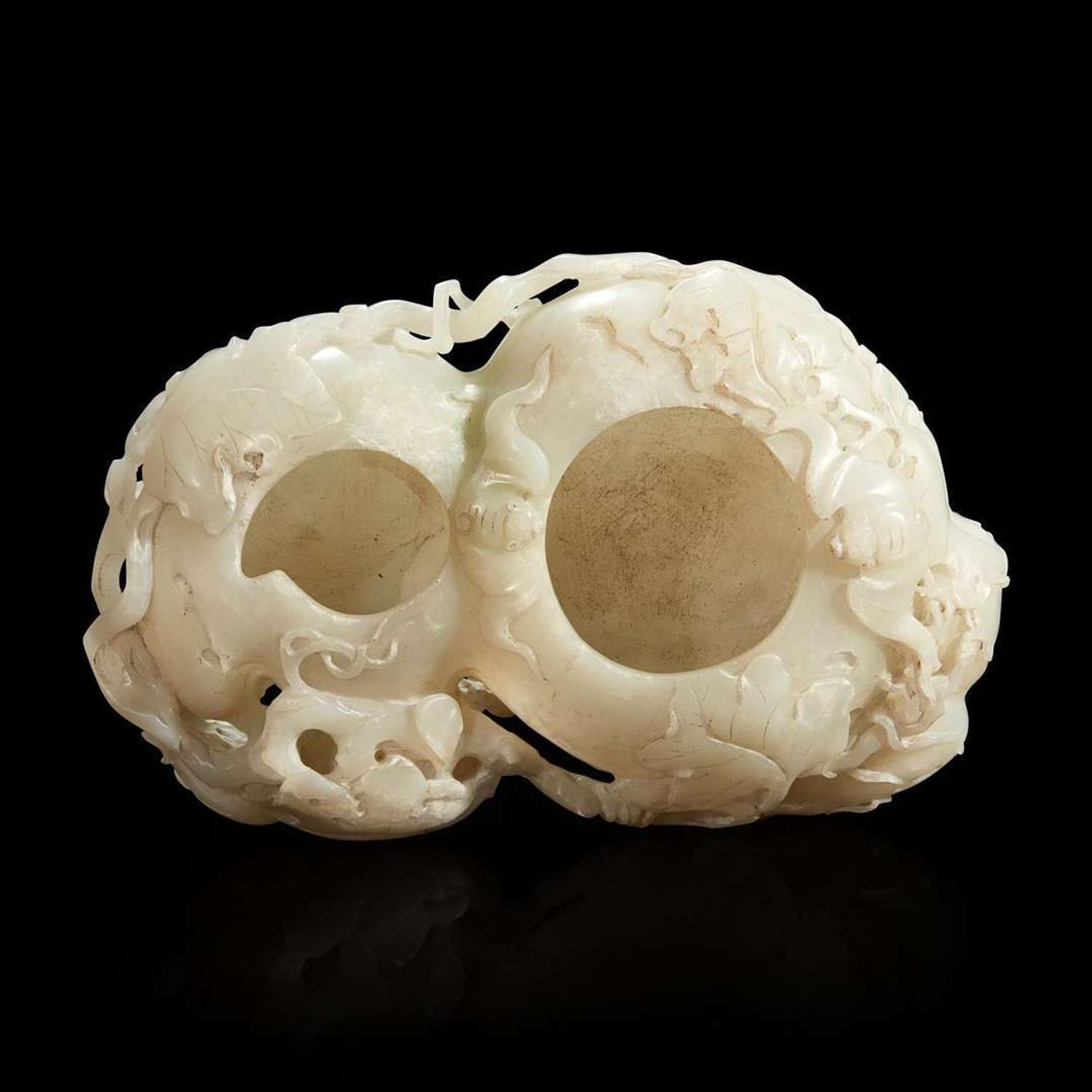 A Chinese carved white jade double-gourd washer with wood stand