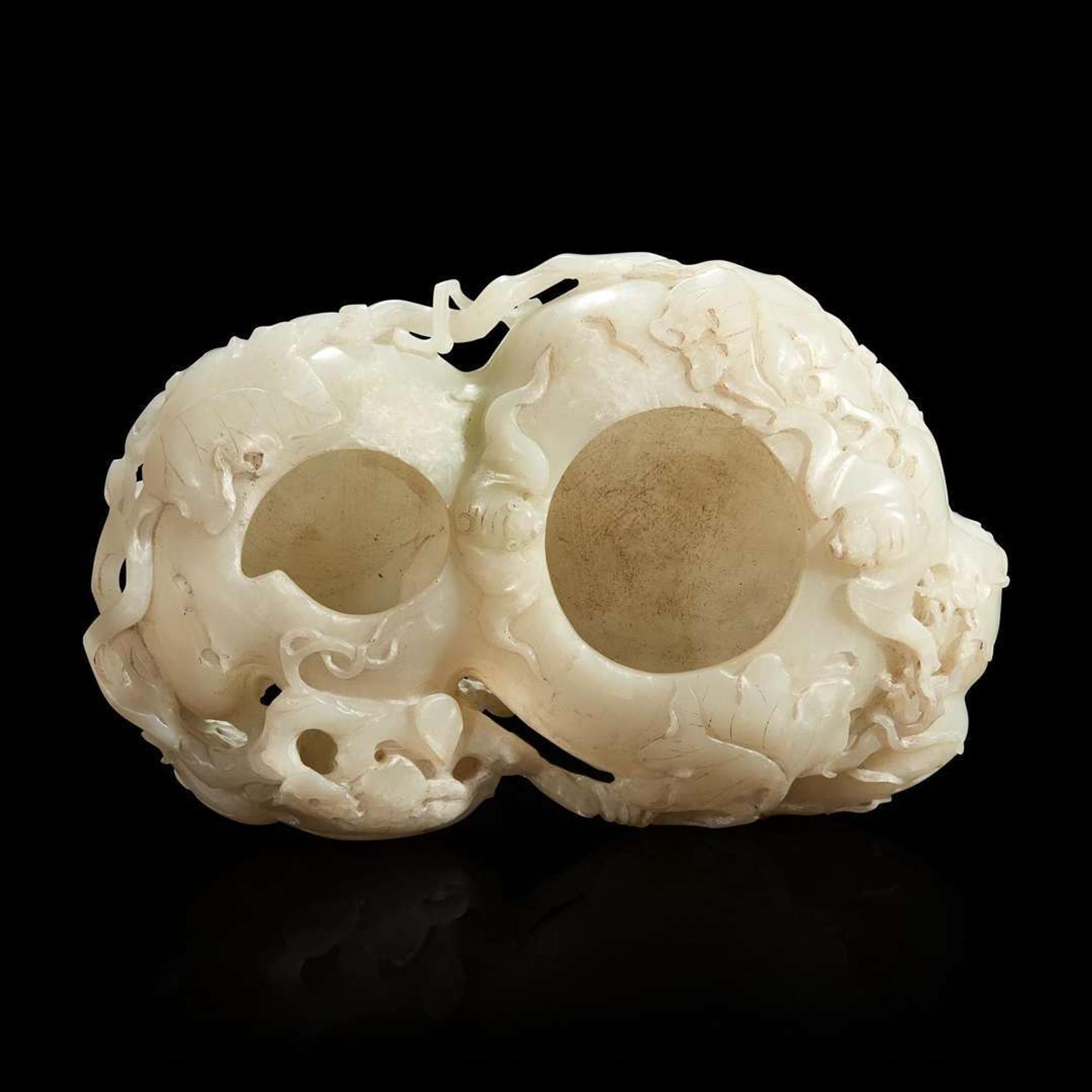 A Chinese carved white jade double-gourd washer with wood stand