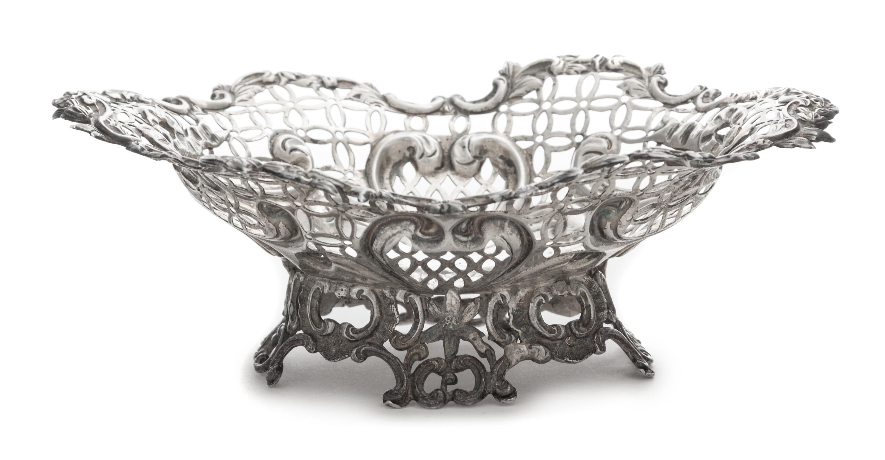 A Victorian Silver Basket, Likely William Comyns, London, 1890, having a pierced body with a C-scroll and floral decorated rim and base