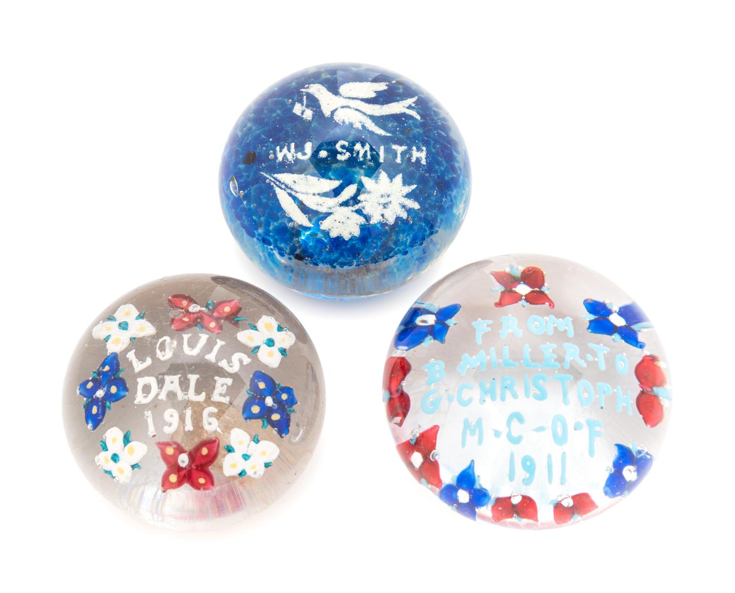 Three American Commemorative Glass Paperweights