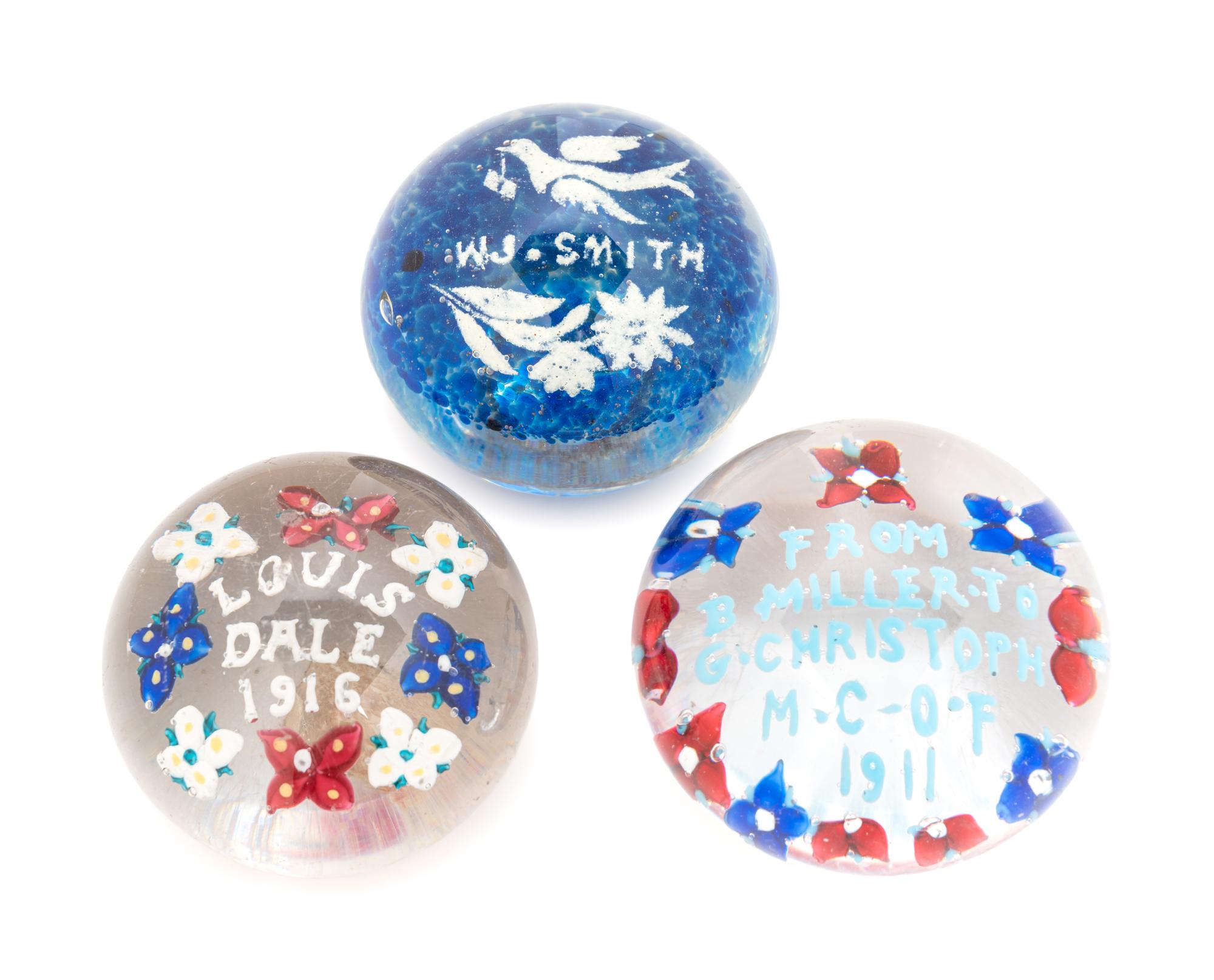 Three American Commemorative Glass Paperweights