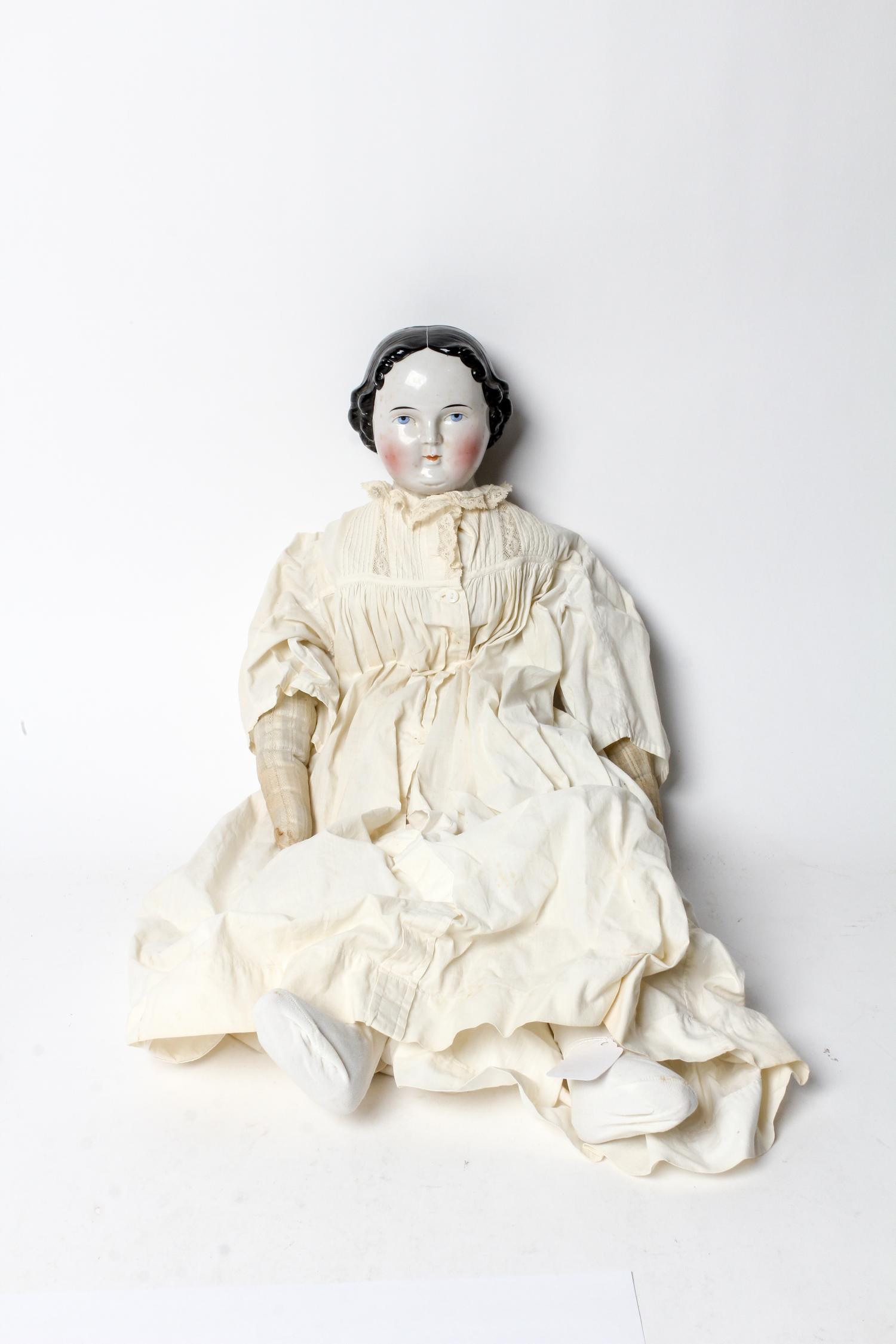 A Victorian Porcelain Headed Doll, attributed to Kister Length 25 inches. — 19TH/20TH CENTURY