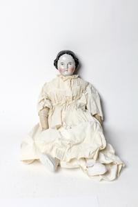 A Victorian Porcelain Headed Doll, attributed to Kister Length 25 inches. — 19TH/20TH CENTURY
