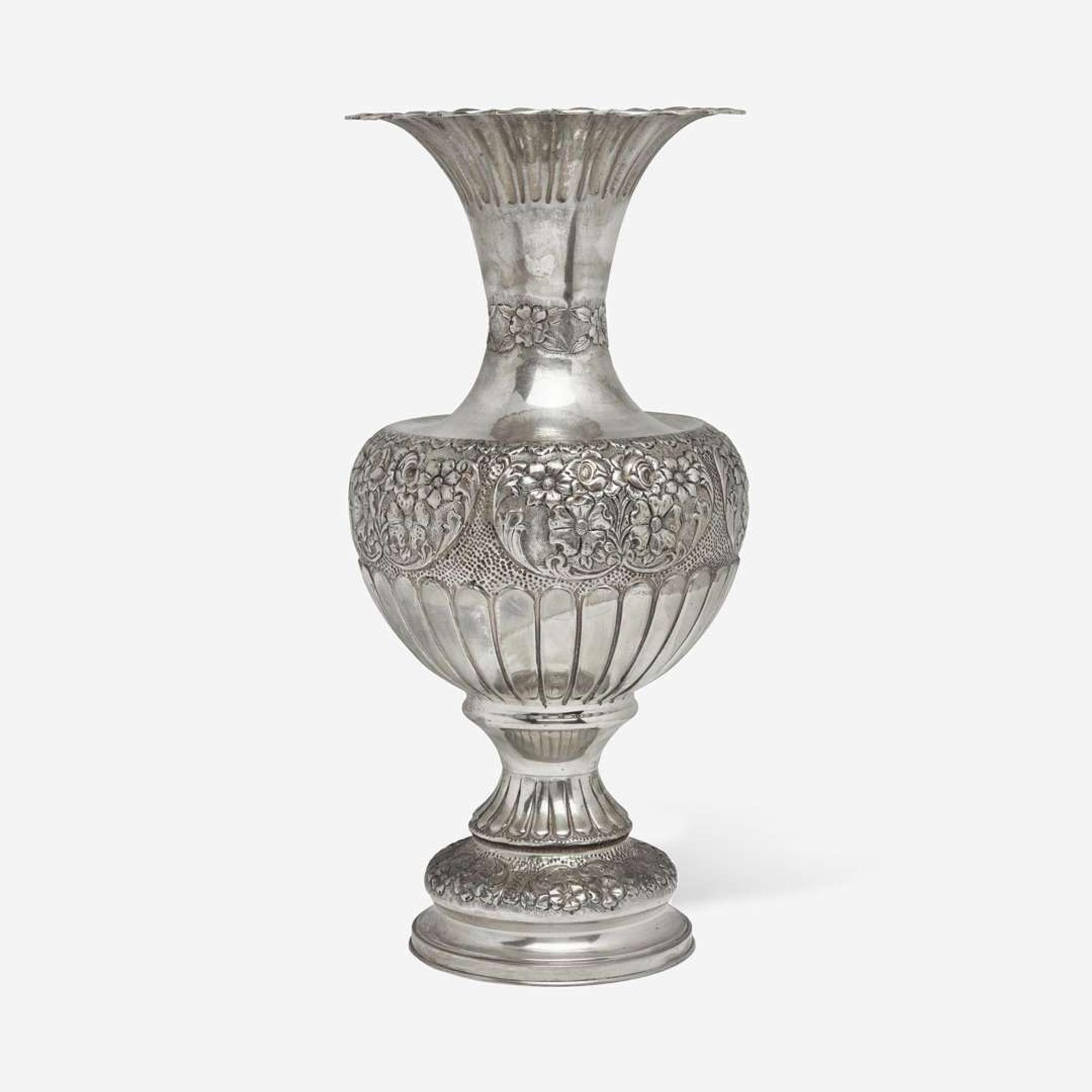 A large sterling silver floral repoussé vase late 19th / early 20th century