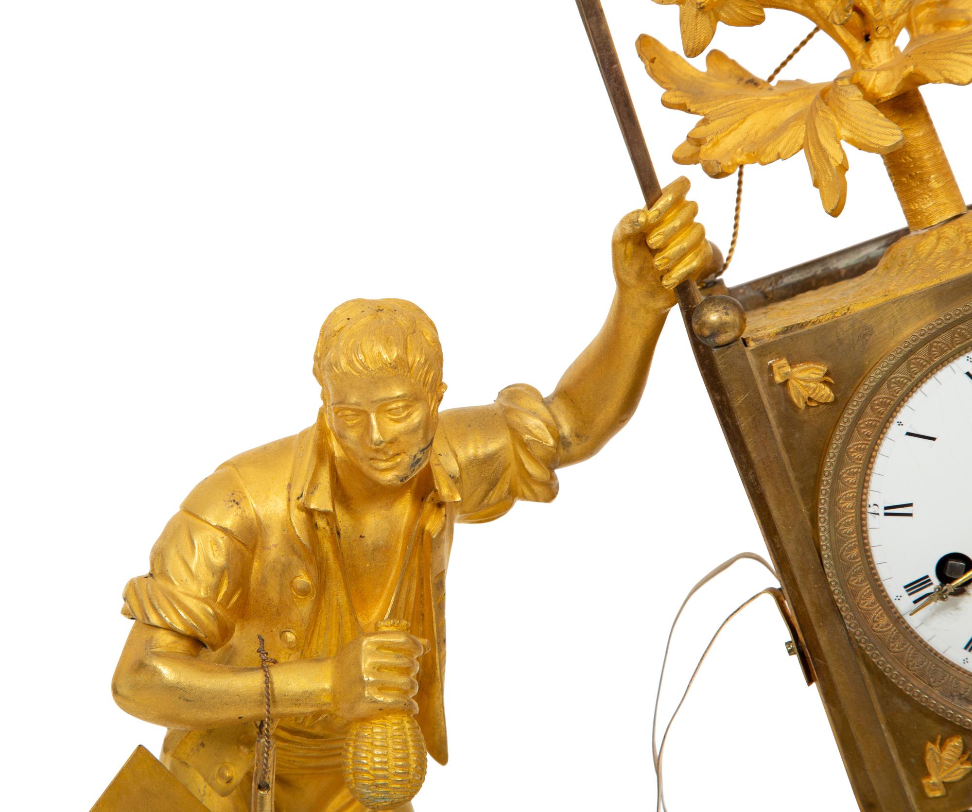 A Restauration Gilt and Patinated Bronze "Gardener" Clock