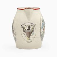 An enamel and transfer-decorated creamware jug Probably Liverpool, England, circa 1800