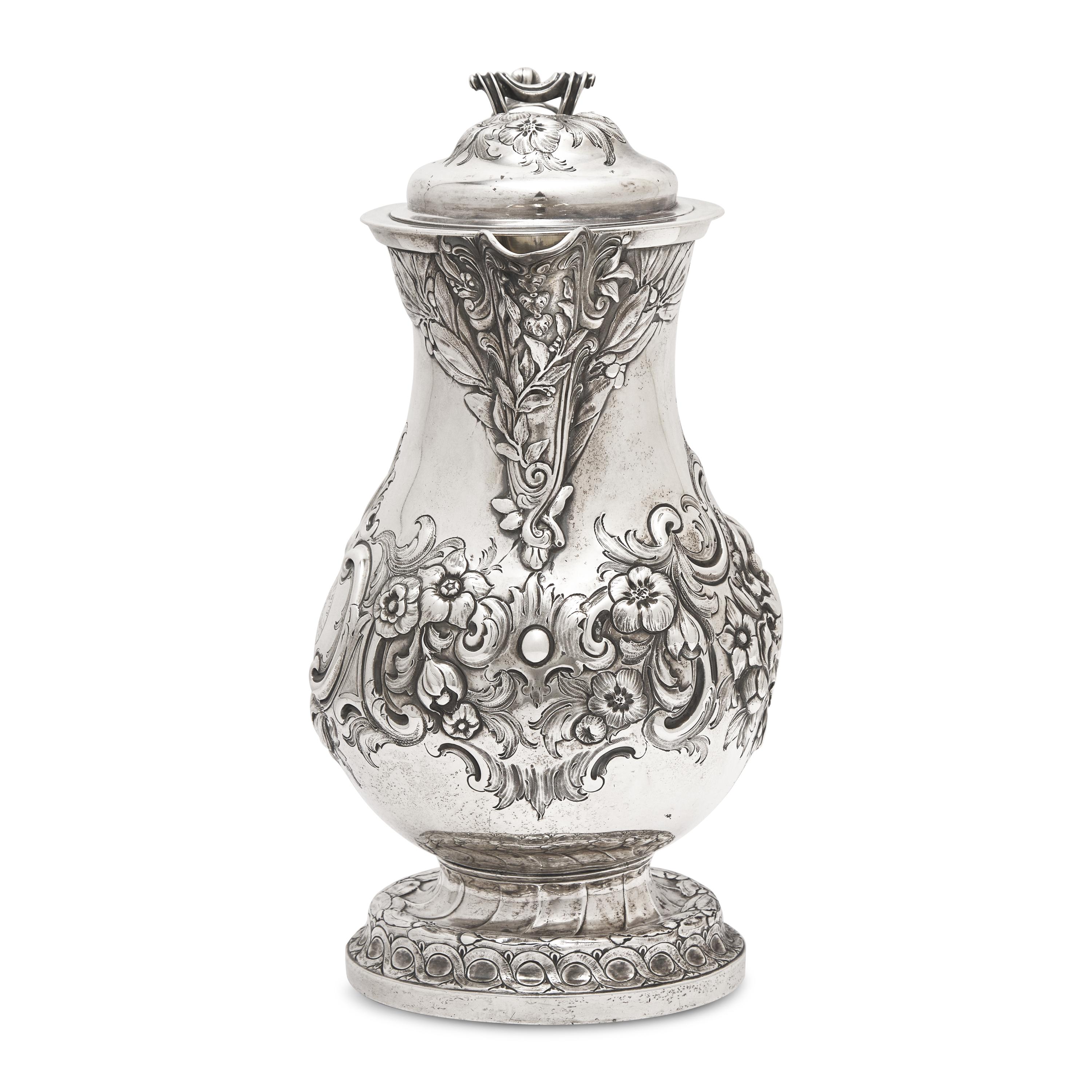 A Belgian Repoussé Silver Ewer