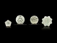 Four Reticulated Celadon Jade Pendants