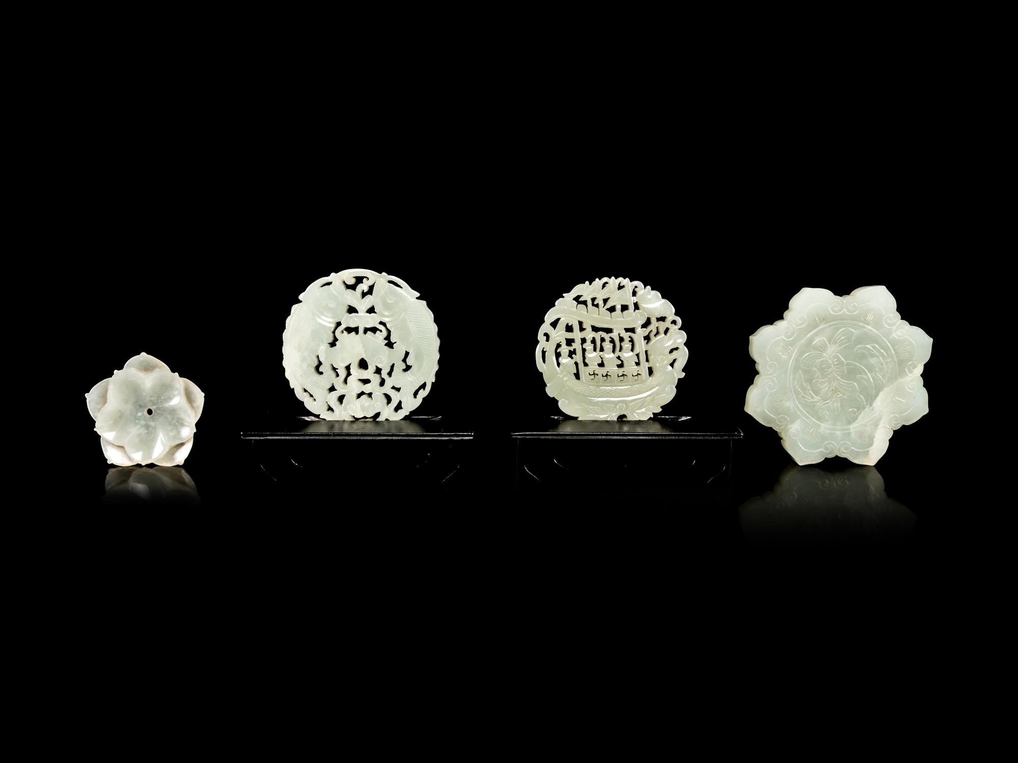 Four Reticulated Celadon Jade Pendants
