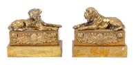A Pair of Brass Mastiff Chenets Width 11 1/2 inches.