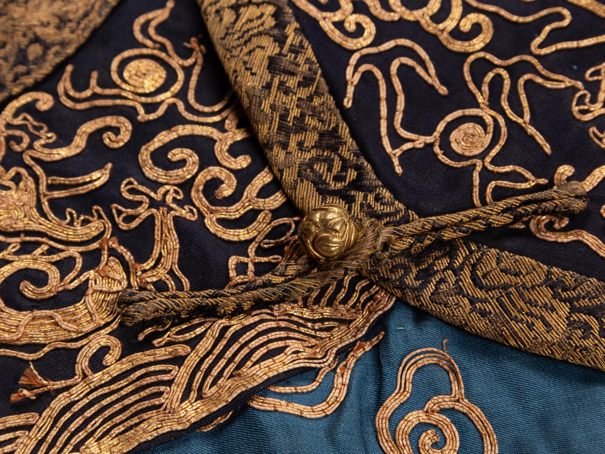 A Blue Ground Embroidered Silk Dragon Robe, Jifu