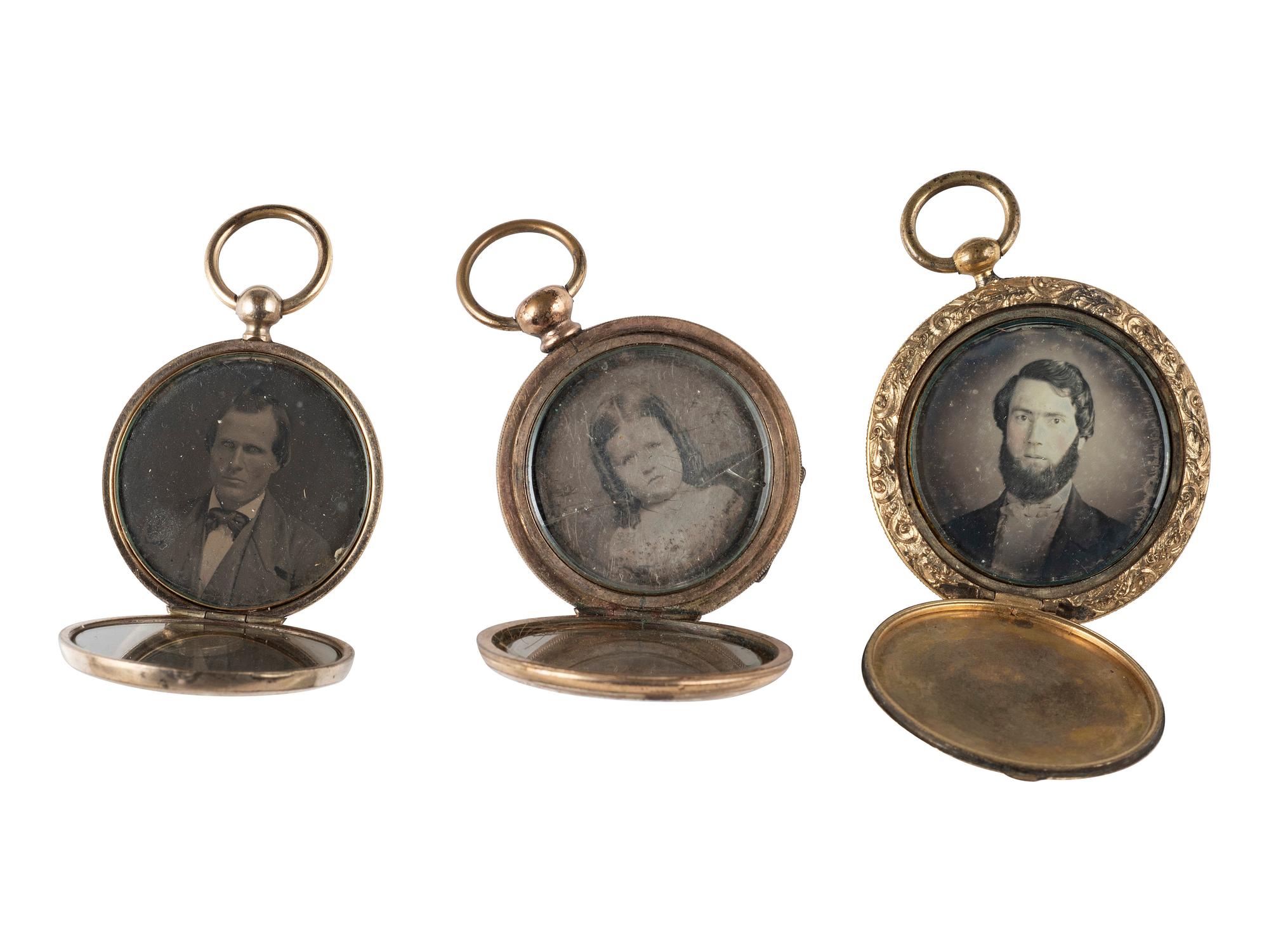 [EARLY PHOTOGRAPHY]. 11 lockets containing daguerreotypes and tintypes.