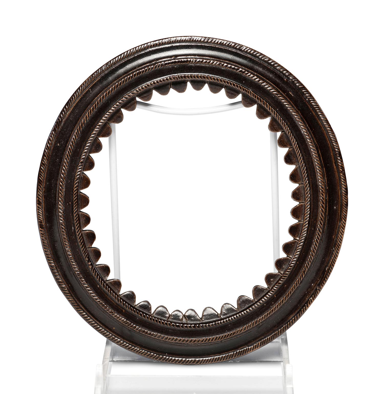 A Circular Stoneware Picture Frame in Albany Slip Glaze