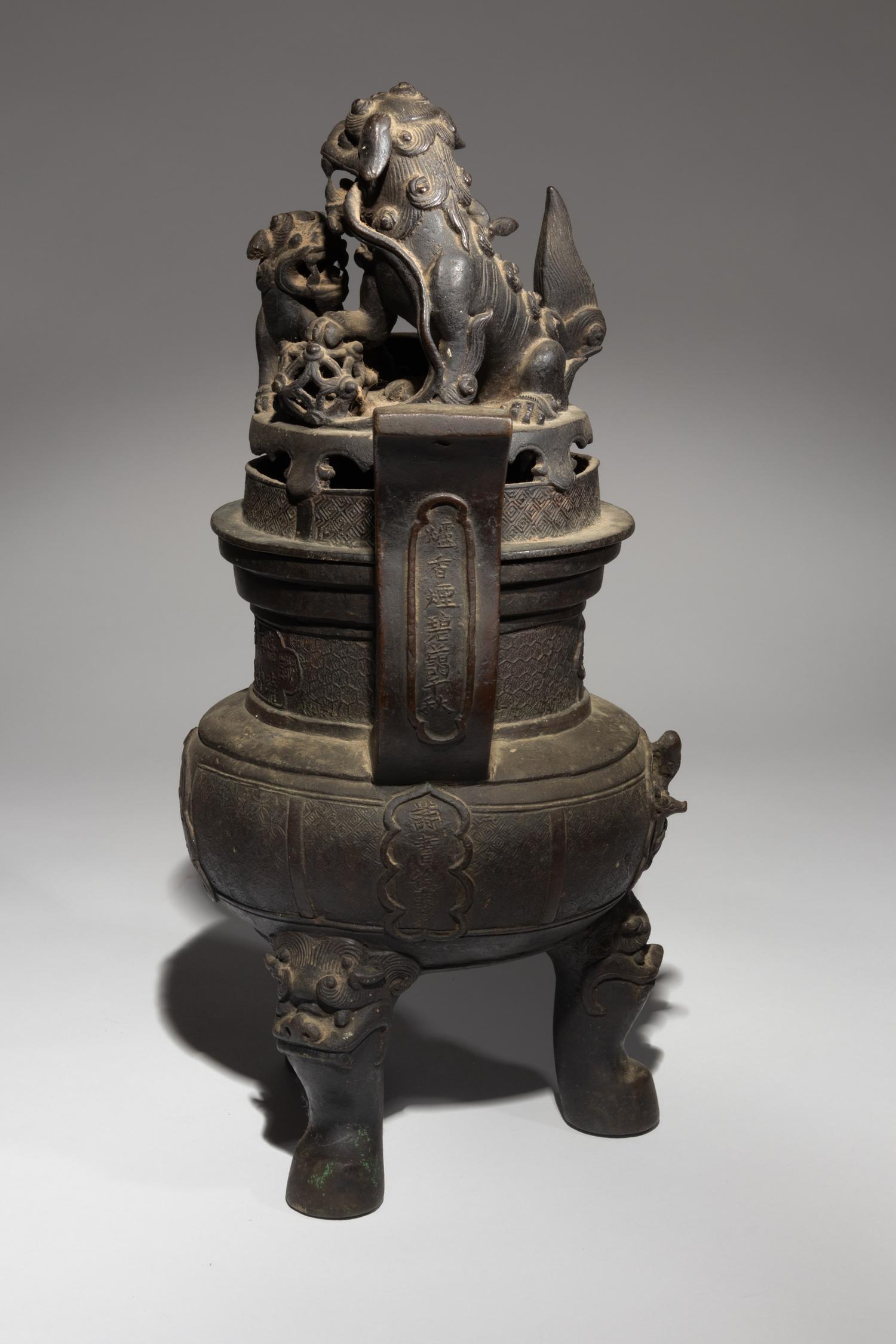 A Bronze Tripod Incense Burner and Cover