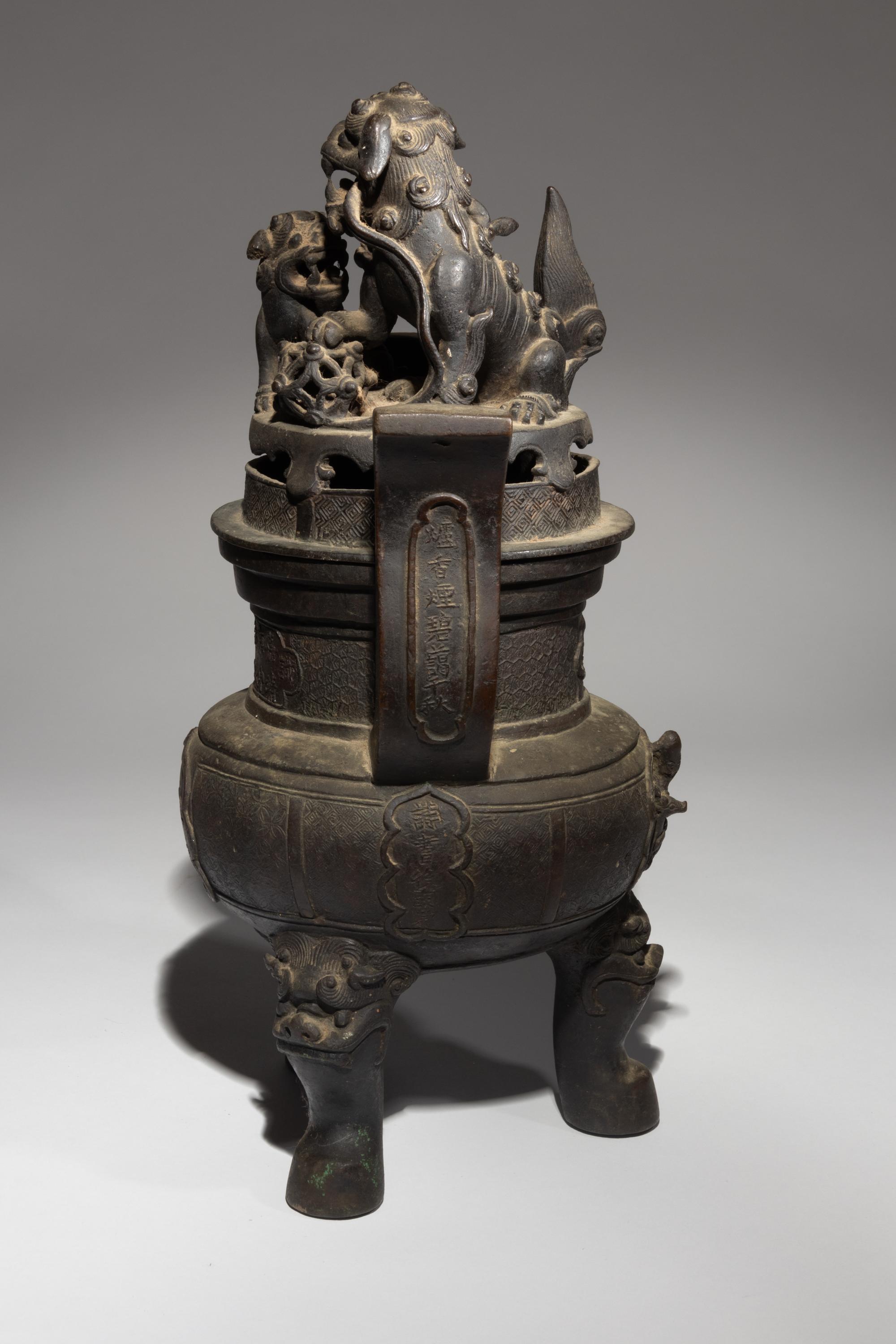 A Bronze Tripod Incense Burner and Cover