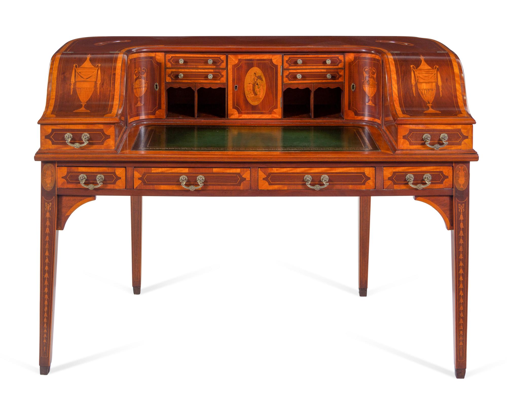 A George III Style Inlaid and Figured Mahogany Leather Inset Carlton House Desk