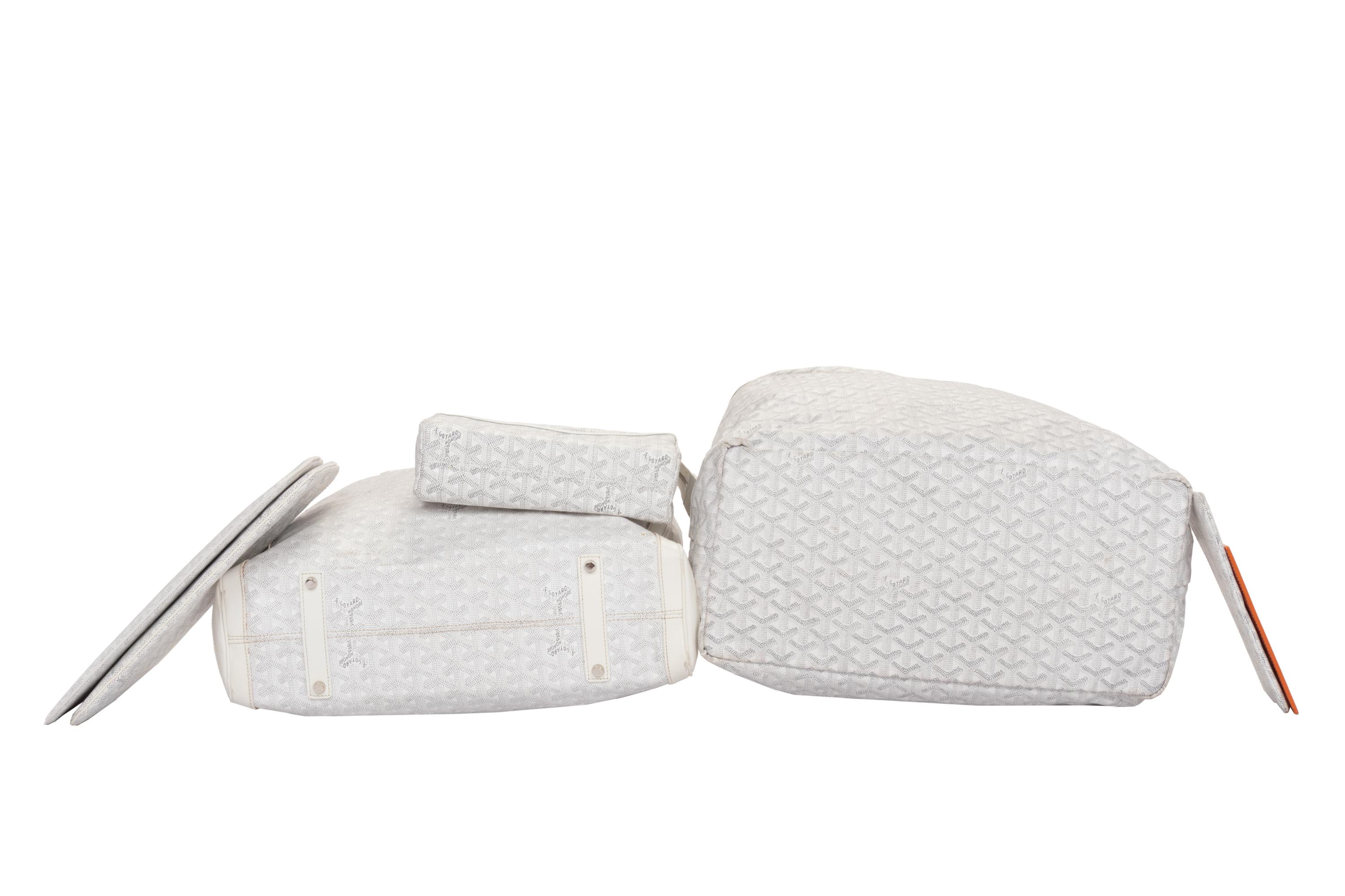 Six Goyard Items: Two Totes, Three Pouches, and One Wallet