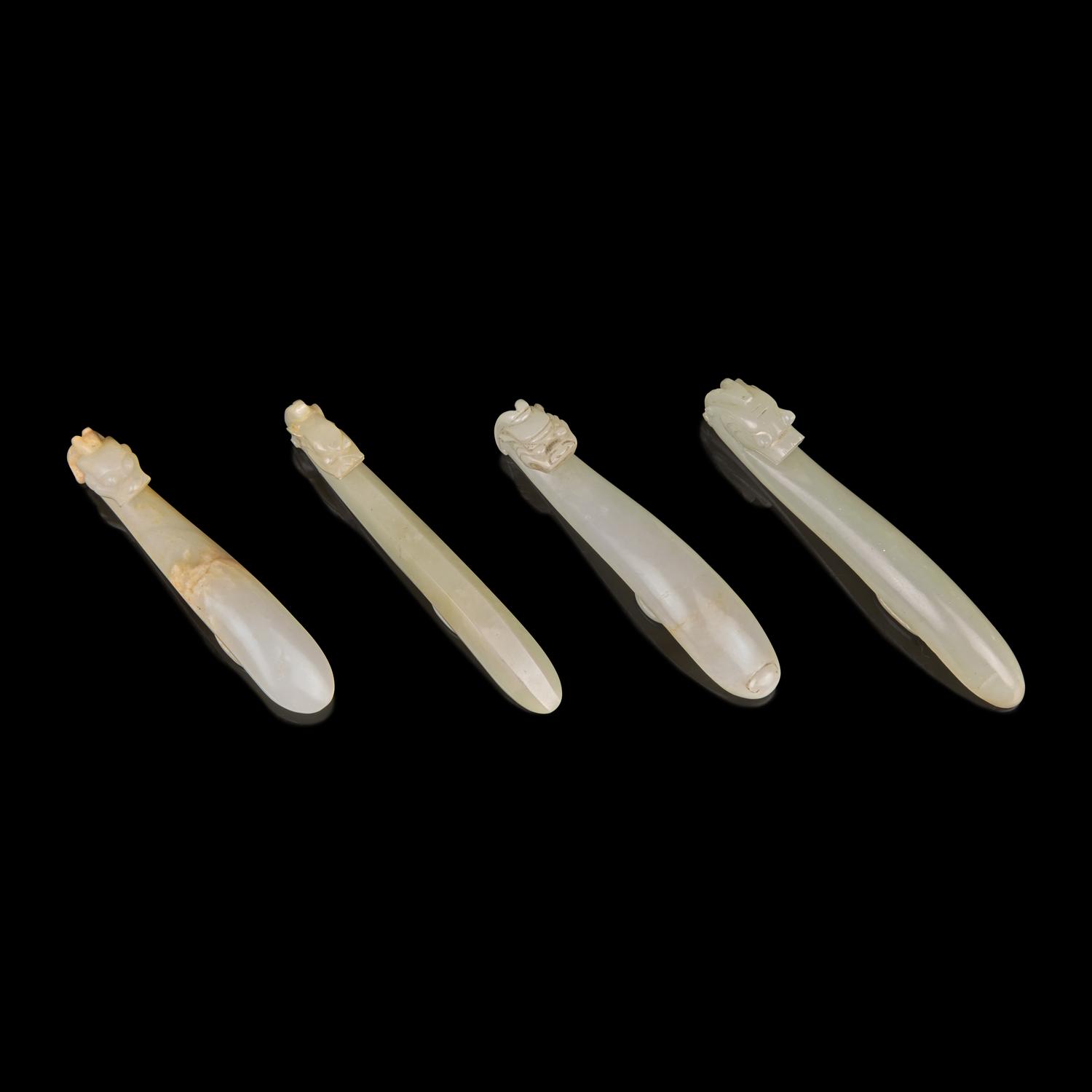 Four Pale Celadon Jade "Dragon" Belthooks, Qing Dynasty 清 青玉龍鉤四件