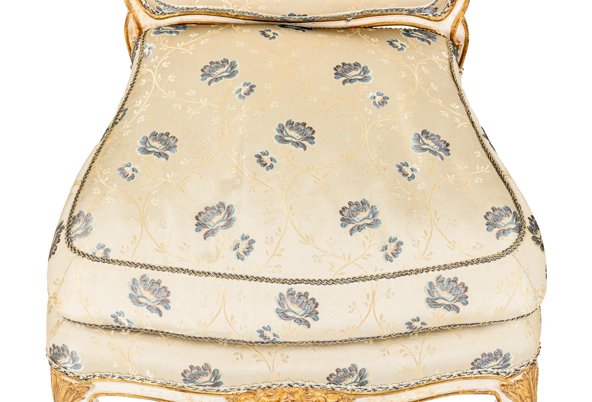 A Pair of Louis XV White-Painted and Parcel-Gilt Side Chairs