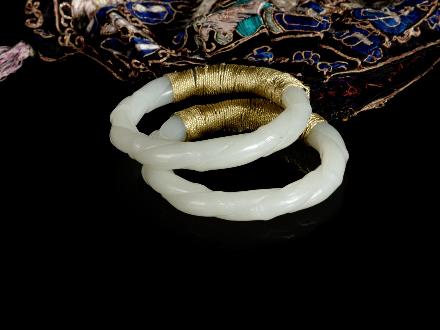 A Chinese Embroidered Silk Purse with a Pair of Jade Bangles