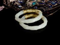 A Chinese Embroidered Silk Purse with a Pair of Jade Bangles