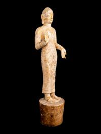 A Chinese Carved Stone Standing Draped Guanyin Figure with Remnants of Gilt on Surface