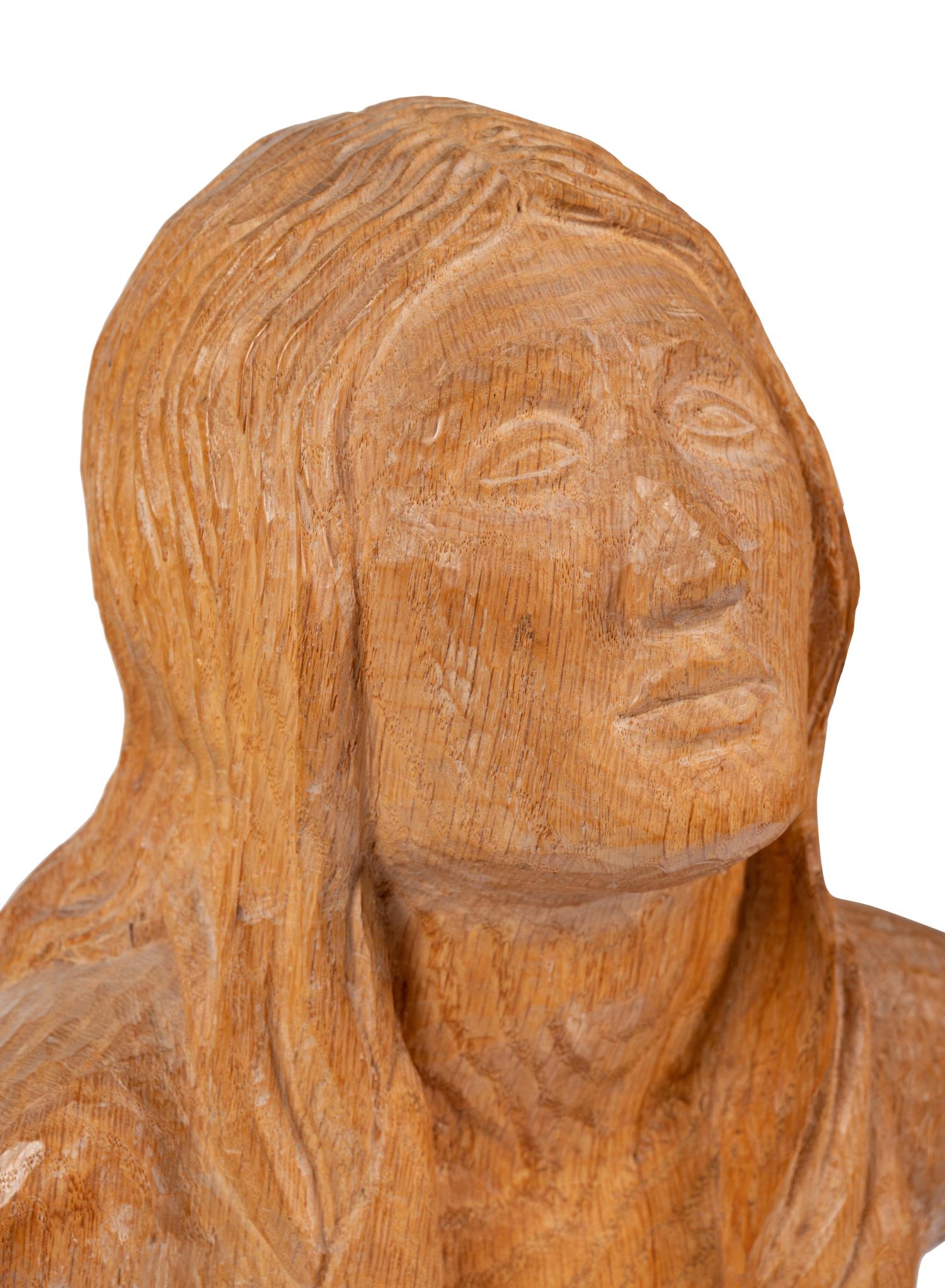 A Carved Oak Figure of a Bound Woman
