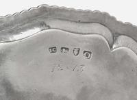 A George III sterling silver salver, John Carter II, London, 1769, and a small Irish George II sterling silver tray, Dublin, 1730