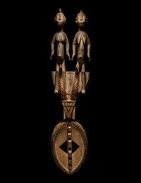 A Bamana Wood Horned Mask with Figures
