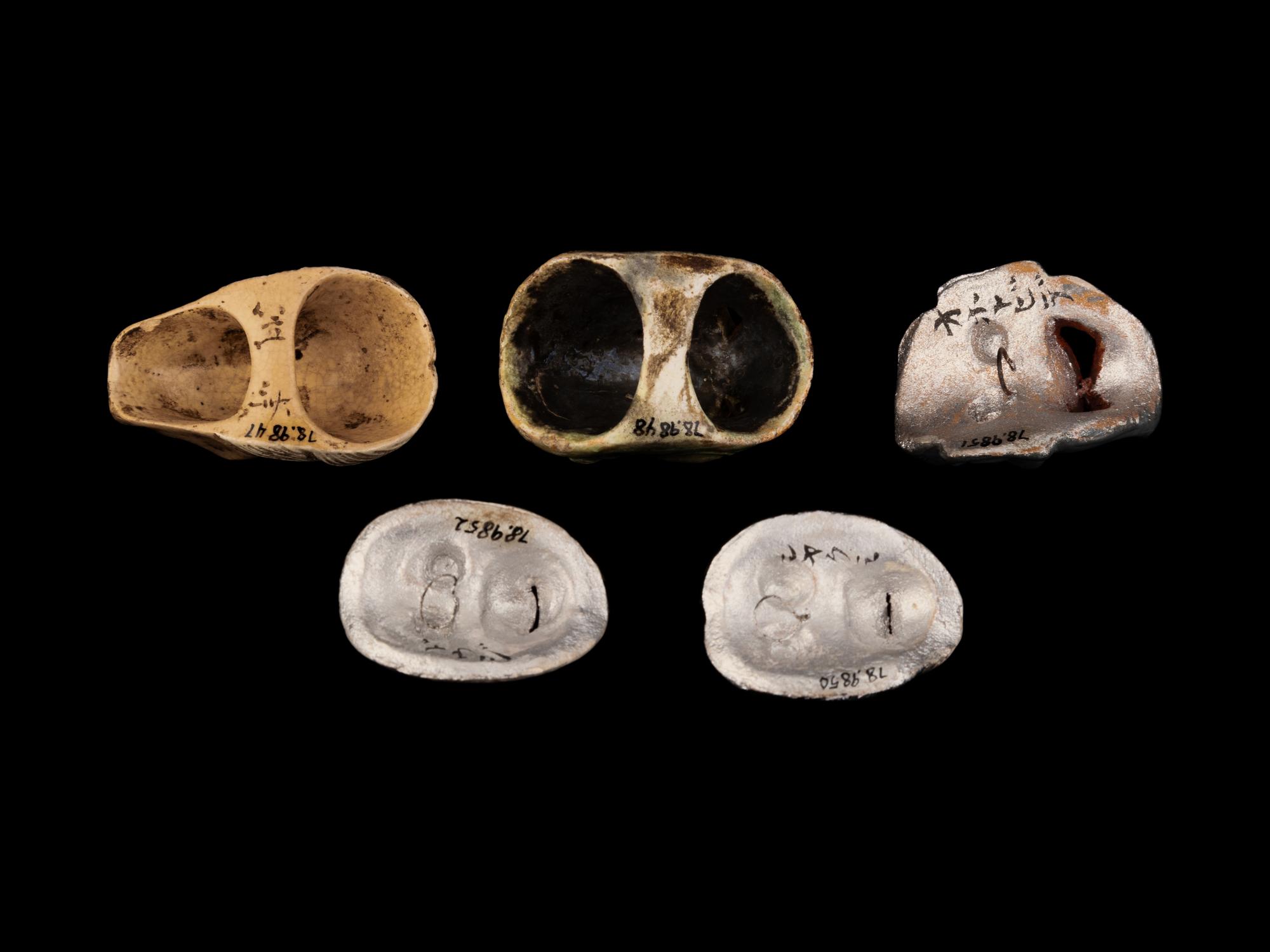 Five Miniature Japanese Ceramic Masks and One Porcelain Figural-Form Netsuke