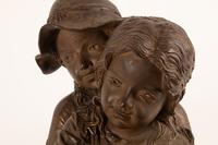 A Continental Patinated Bronze Group of Children in the Garden