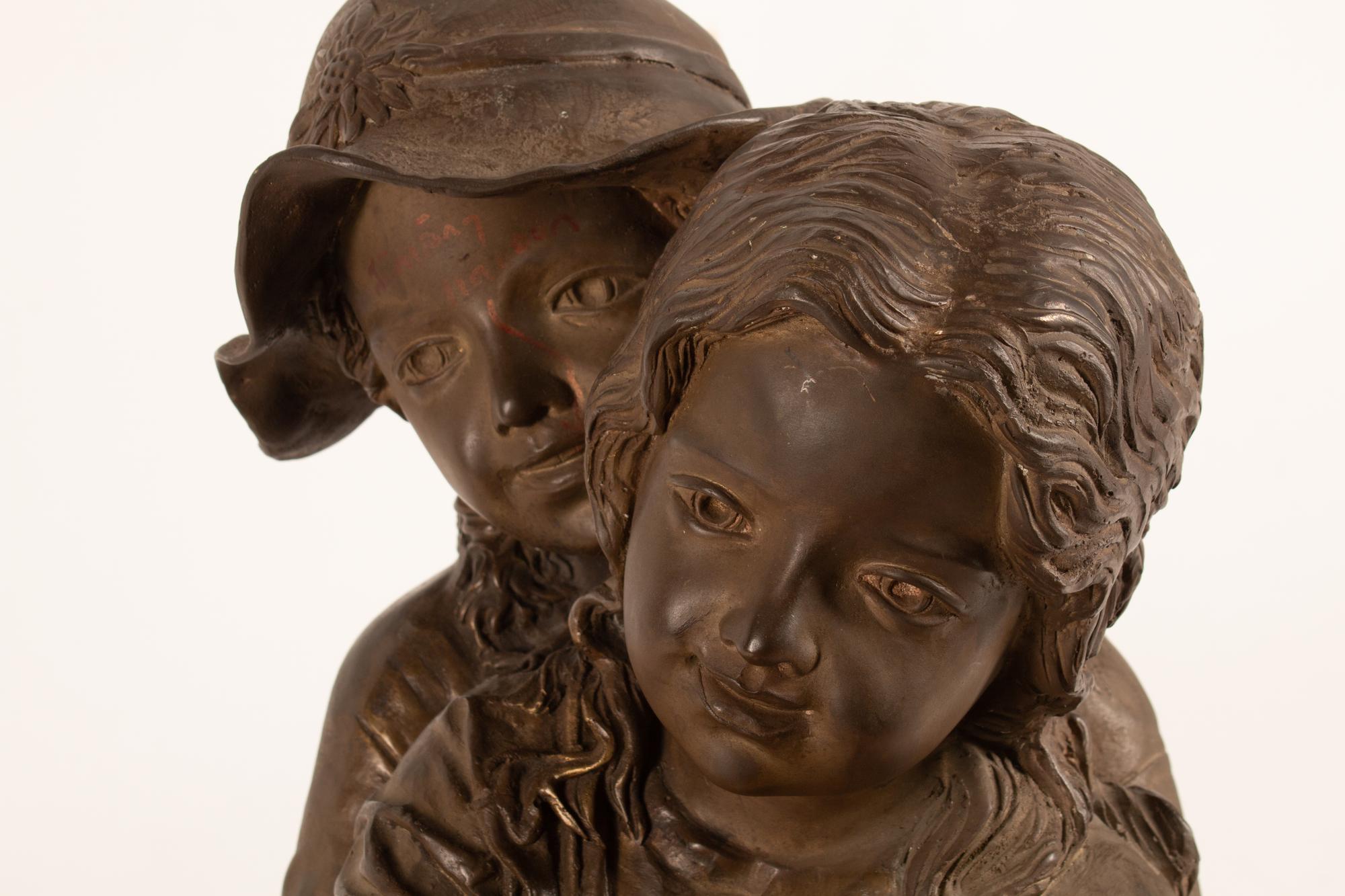 A Continental Patinated Bronze Group of Children in the Garden