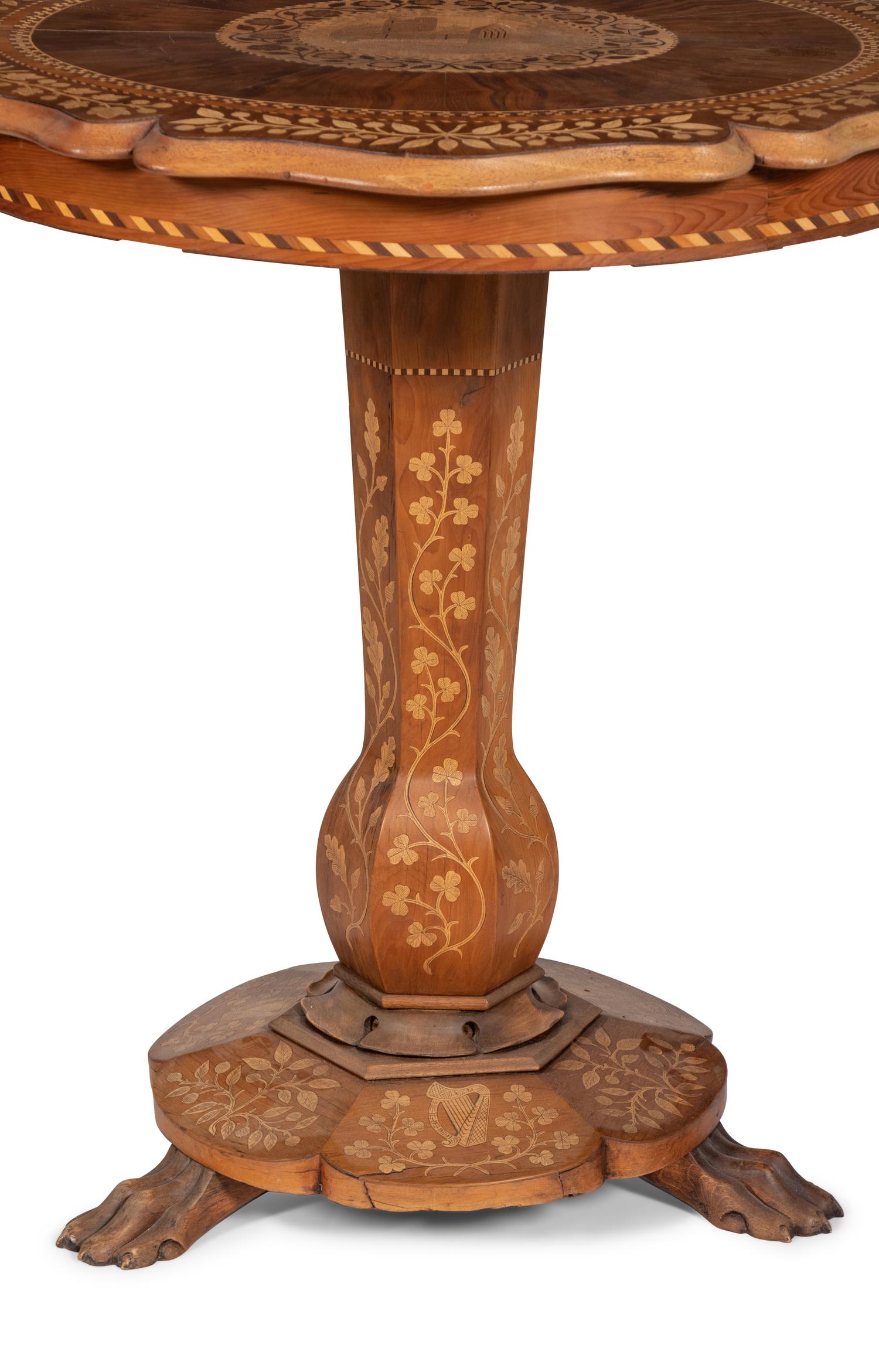 A Continental Marquetry Table on Claw Feet