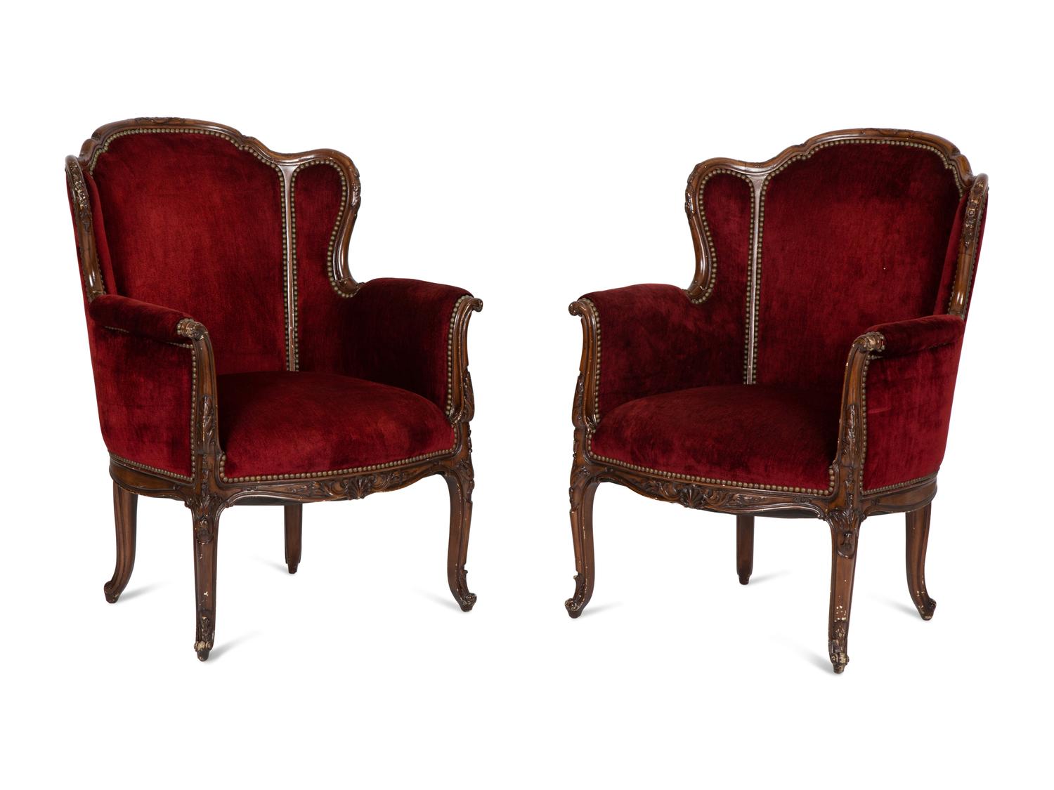 A Pair of Louis XV Style Walnut Bergères